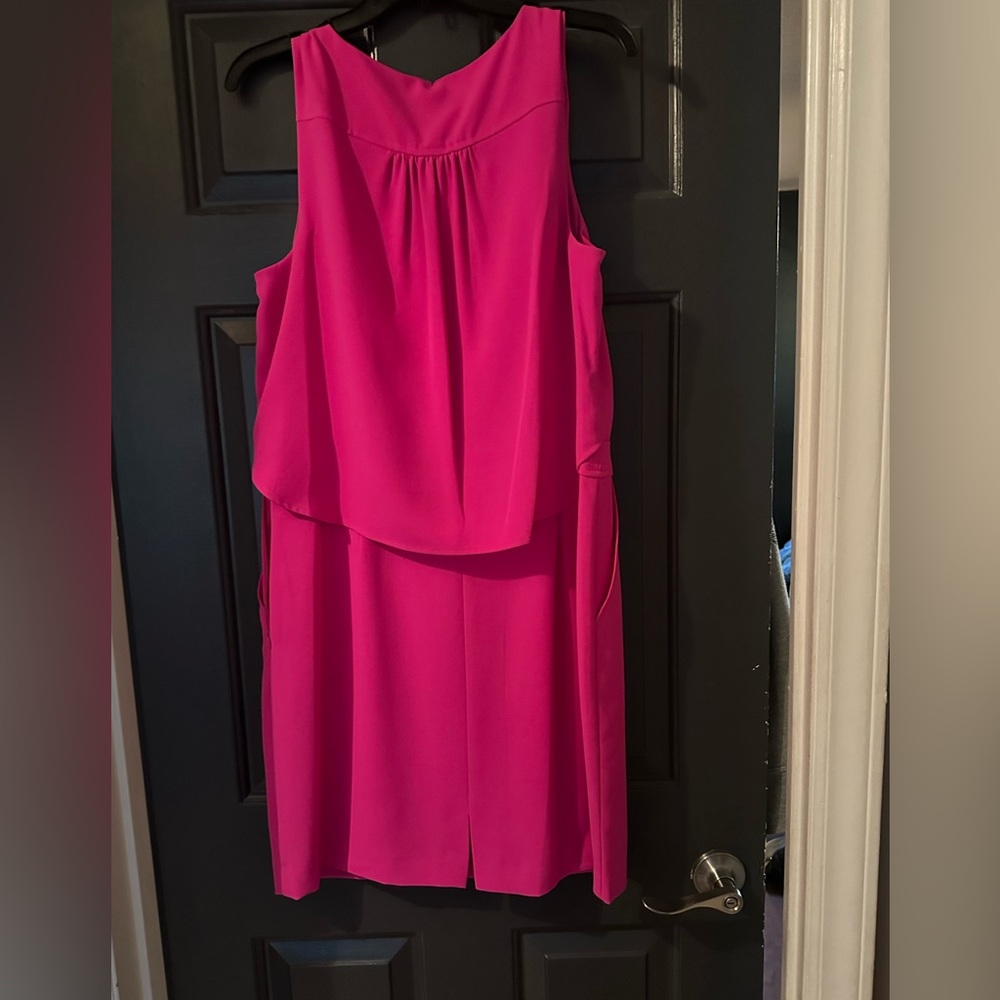 Ladies pink sleeveless dress with pockets. Pleated in back